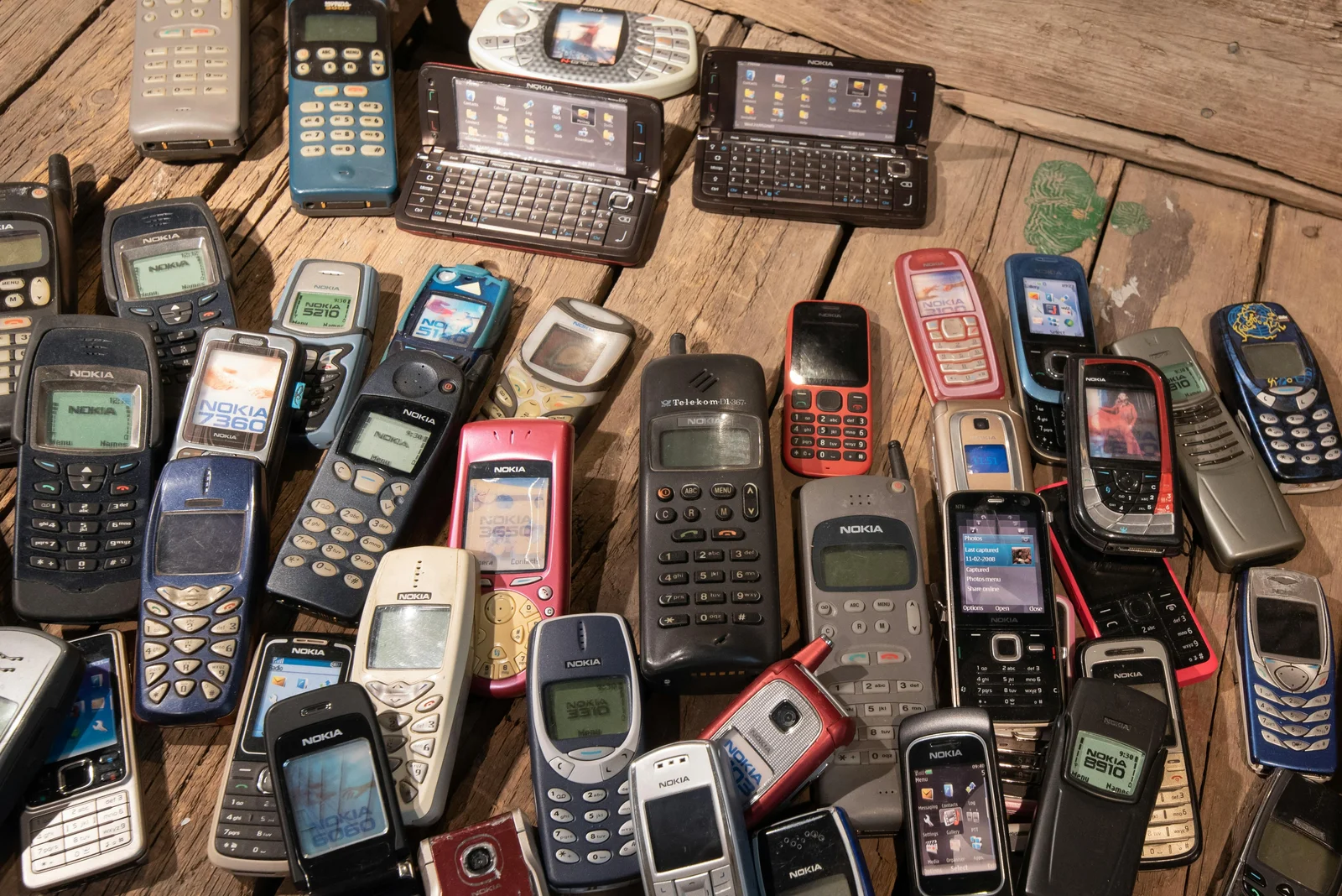 A collection of obsolete mobile devices.