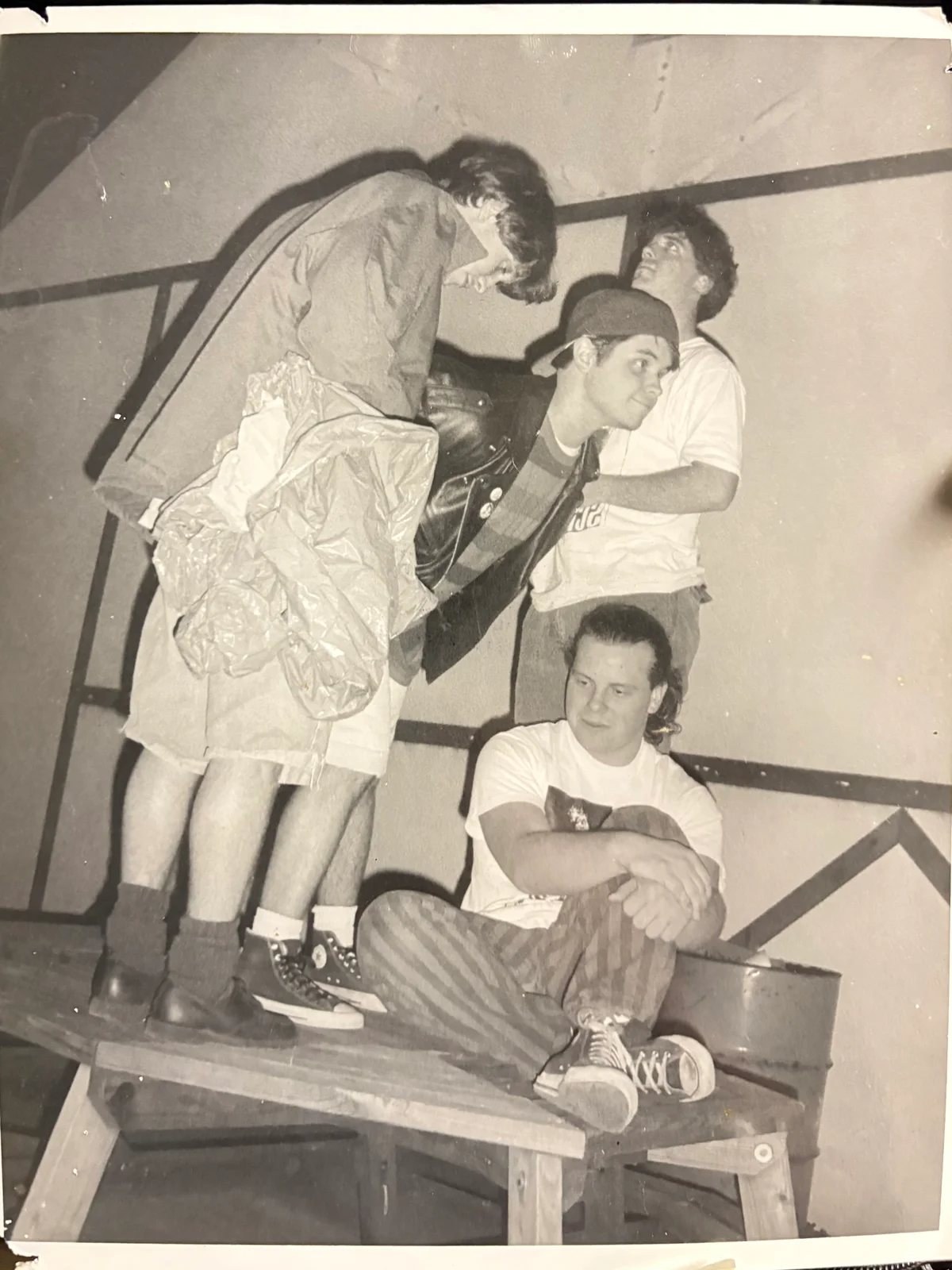 Scott, me, Tim, and Dave pose awkwardly on top of a picnic table.