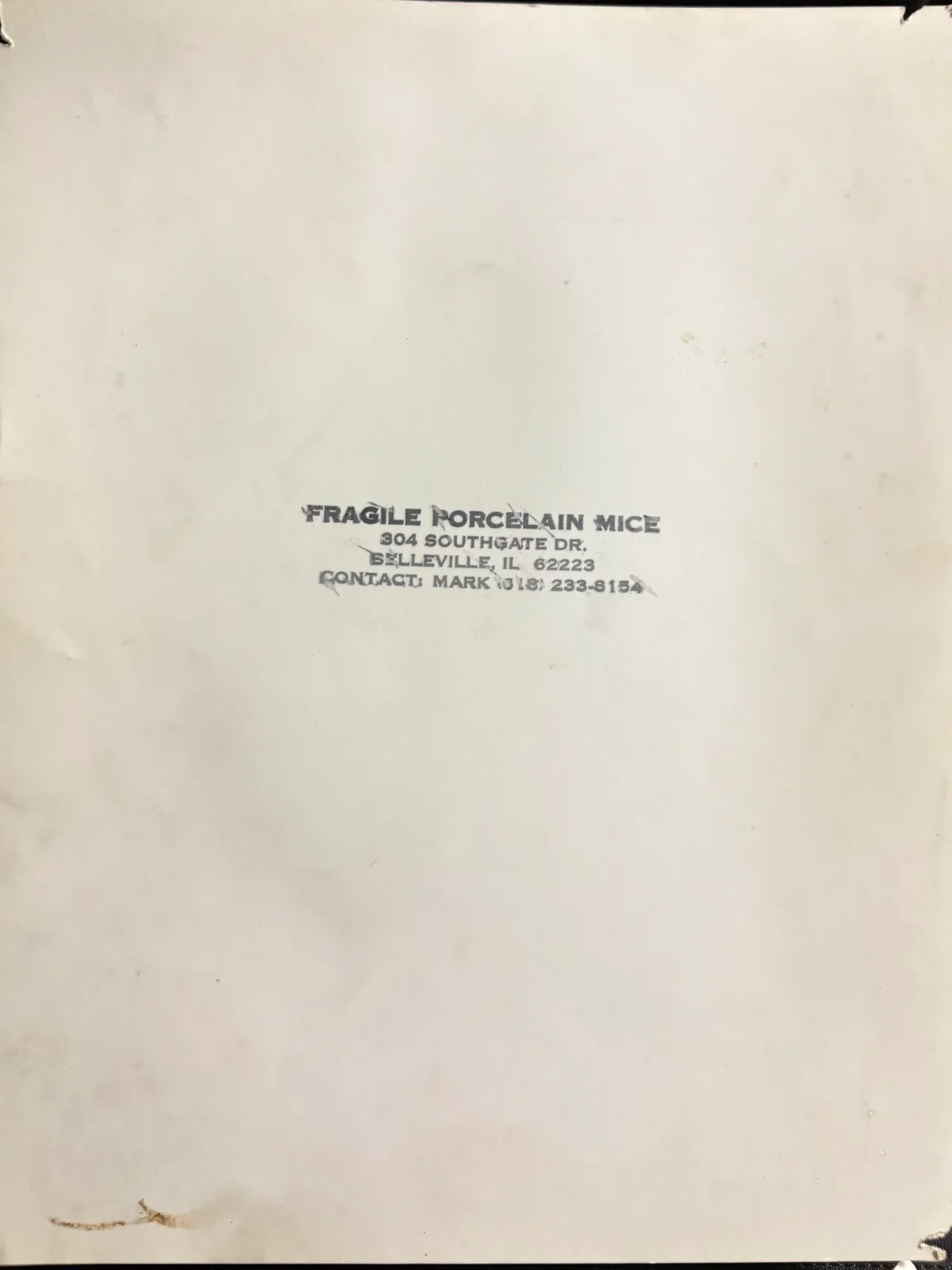 The back of the old band photo, featuring rubber stamped contact info.