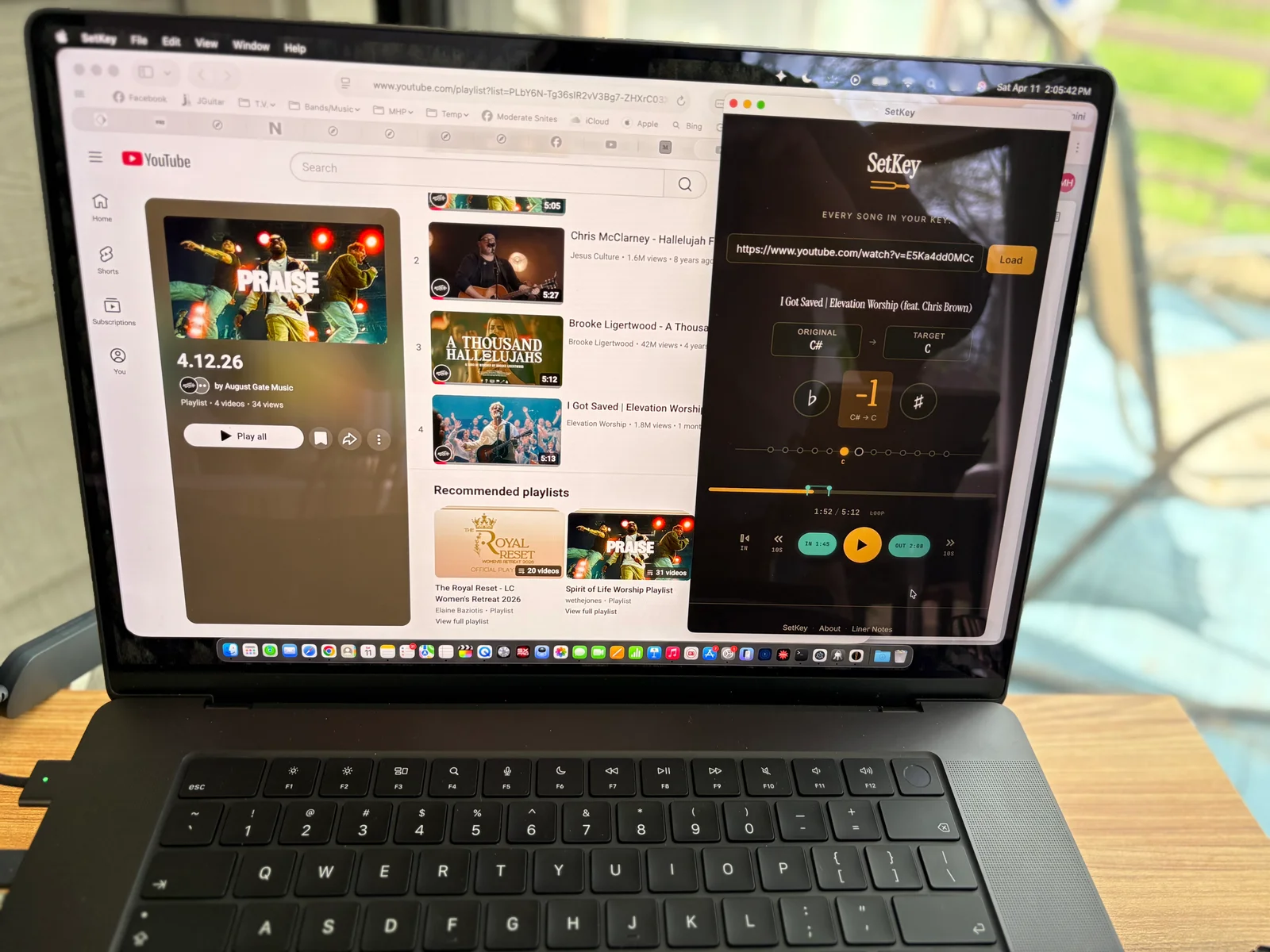 A photo of my laptop running SetKey on top of a YouTube playlist screen.