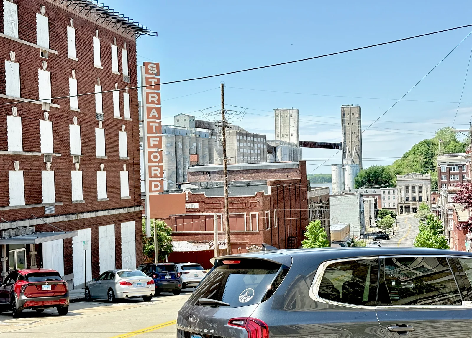The view from the truck outside of Post Commons looking toward the river. Lots of old, brick buildings and a really steep, old Alton street.