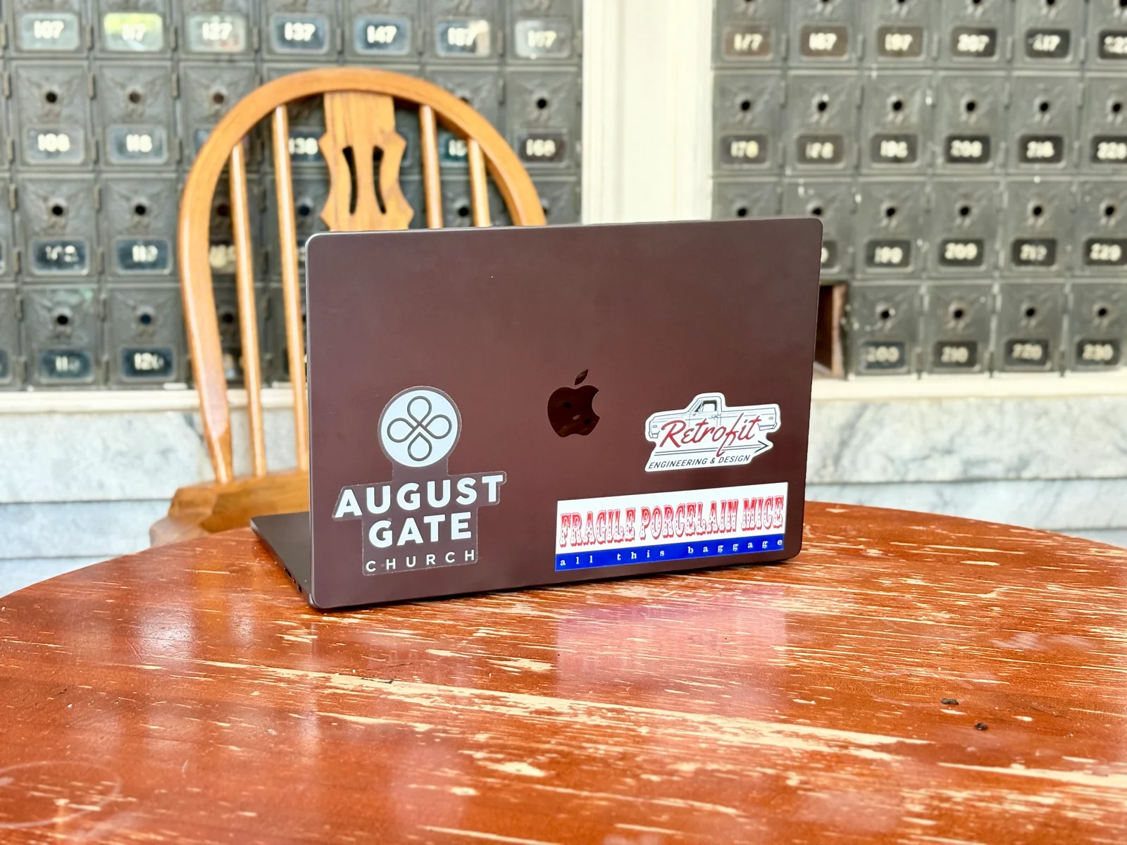 My MacBook Pro adorns a wooden round top table at Post Commons.